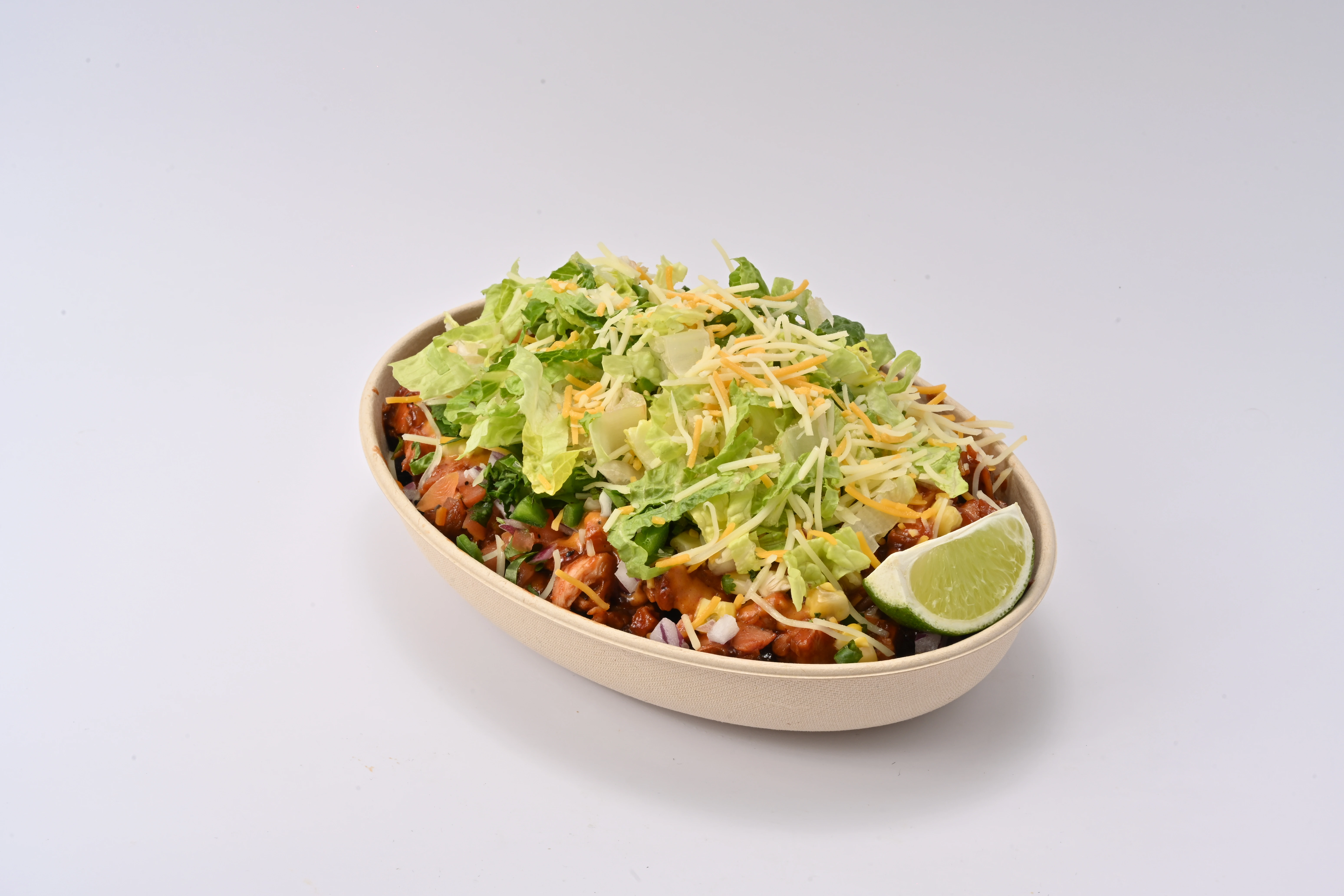 Taco Tek halal burrito bowl with fresh rice, beans, and toppings in the Bronx