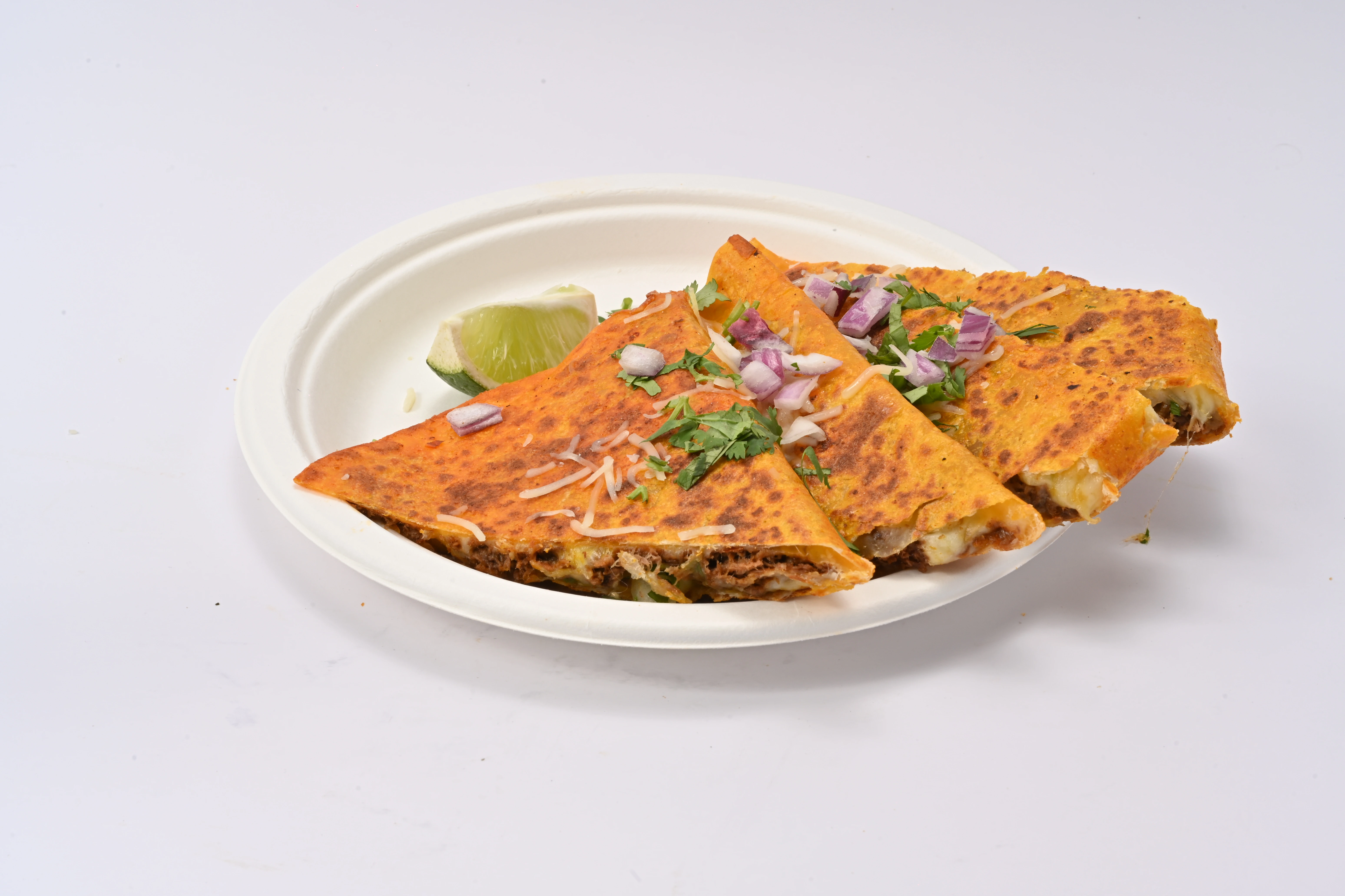 Taco Tek golden quesadilla with melted cheese and fajita veggies